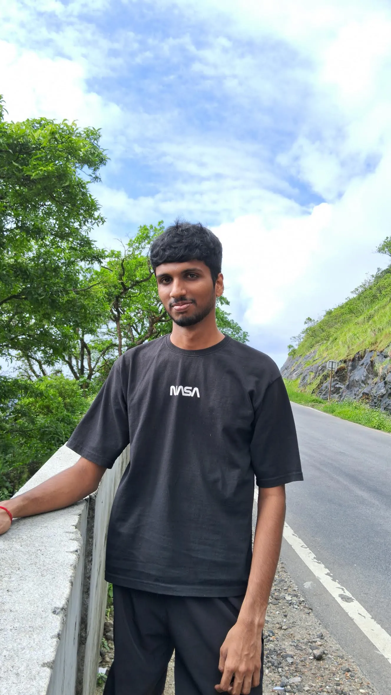 Srujan on a hill road in the Western Ghats